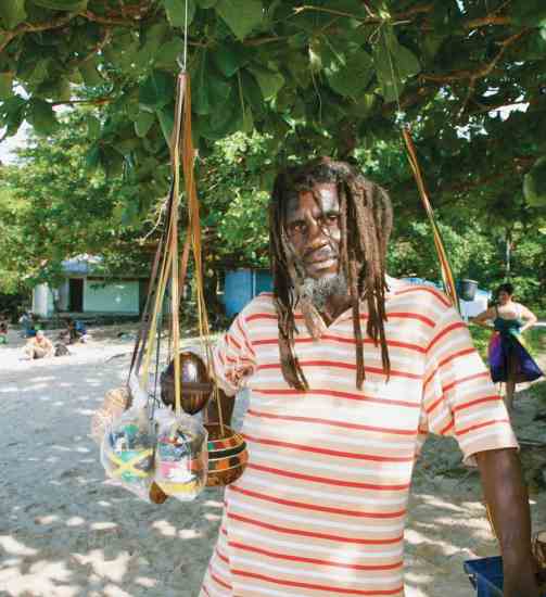 I-Cliff, a Rastafarian, sells his handmade crafts at Winnifred Beach.